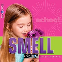 A book cover showing a girl smelling a bouquet of flowers