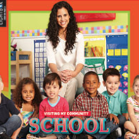 A book cover with a picture of a teacher in front of smiling students