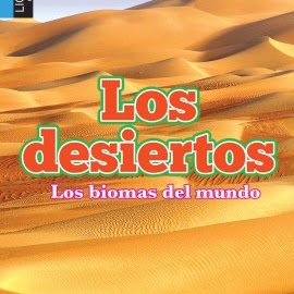 A book cover shows an expansive desert landscape with undulating sand dunes under a clear sky, featuring the Spanish title "Los desiertos" in large orange and green letters with "Los biomas del mundo" in smaller pink text below