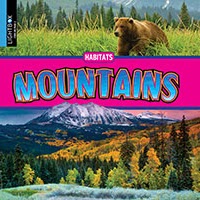 A book cover features a brown bear in a grassy field at the top, a bright pink band with the title "Mountains" in large blue and yellow letters in the middle, and a majestic snow-capped mountain range with autumn trees in the foreground at the bottom.