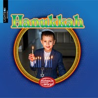 A book cover showing a child lighting a menorah