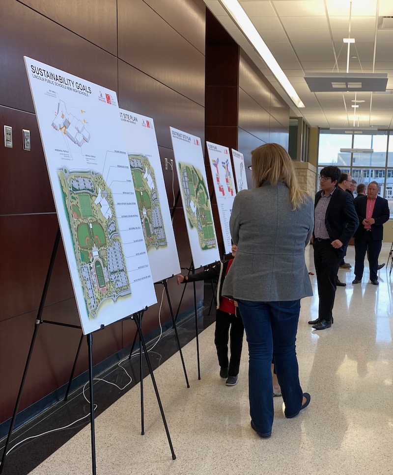 Photo of Design Open House Participants reviewing plans