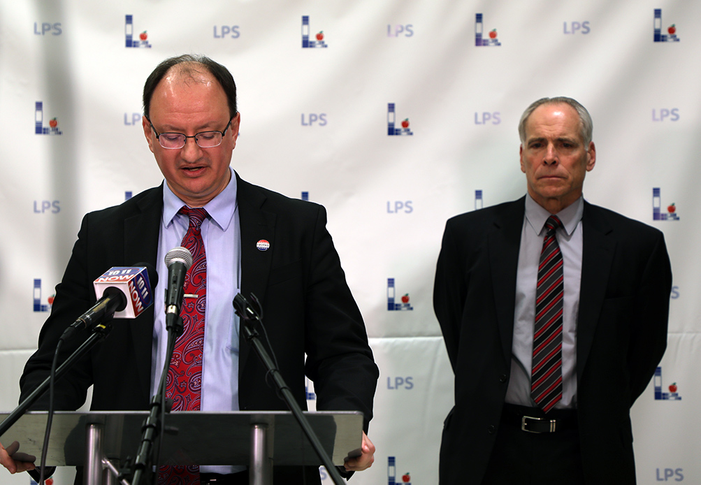 School board president Lanny Boswell and Superintendent of schools Steve Joel address the media