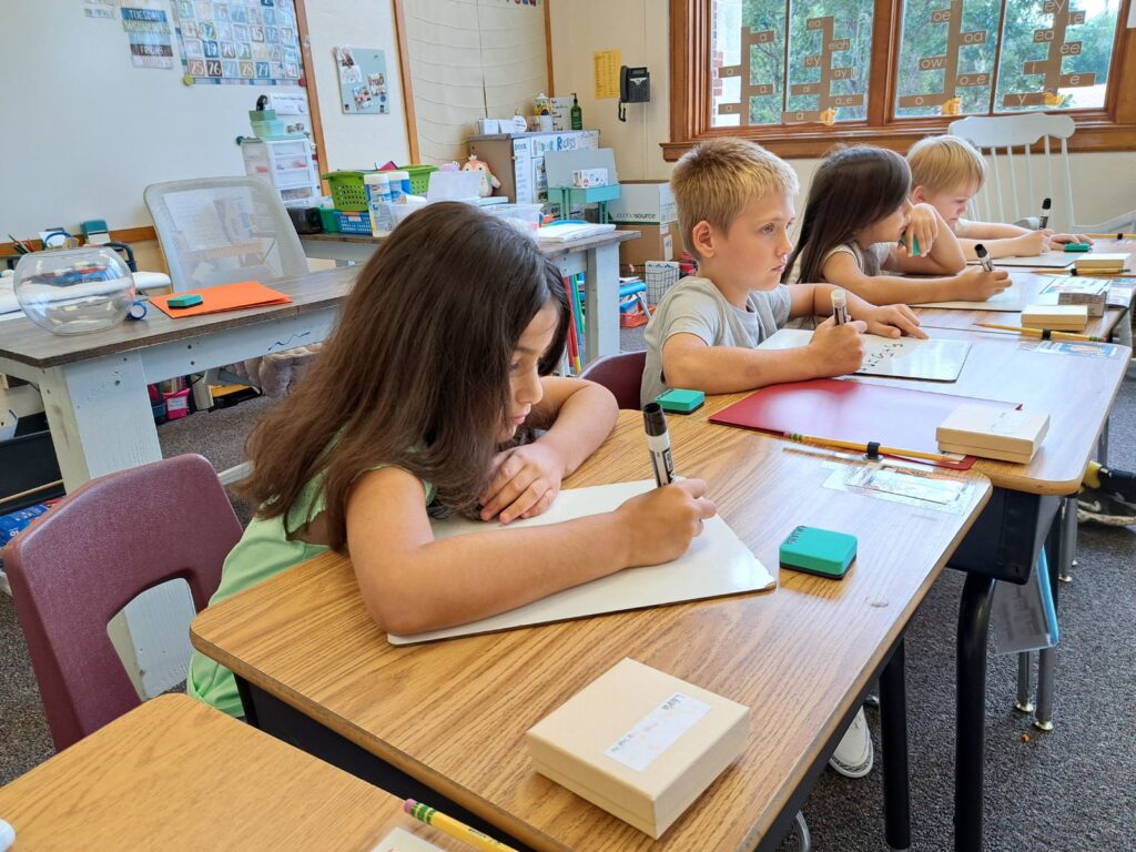 Elementary student working at a desk