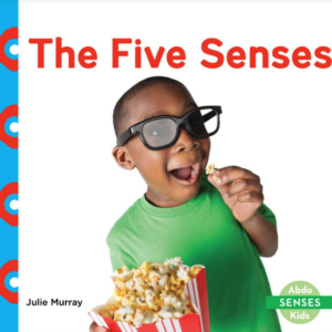 A book cover showing a boy laughing while eating popcorn.