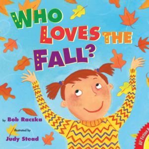 A book cover features a cartoon illustration of a smiling child with reddish-brown pigtails and a yellow sweater with blue zigzags, looking up with outstretched arms amidst falling autumn leaves against a light blue background.