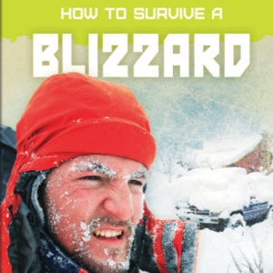 A photo of a man with snow on his face in a field with lots of snow