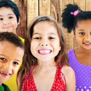 A picture of a group of kids smiling.