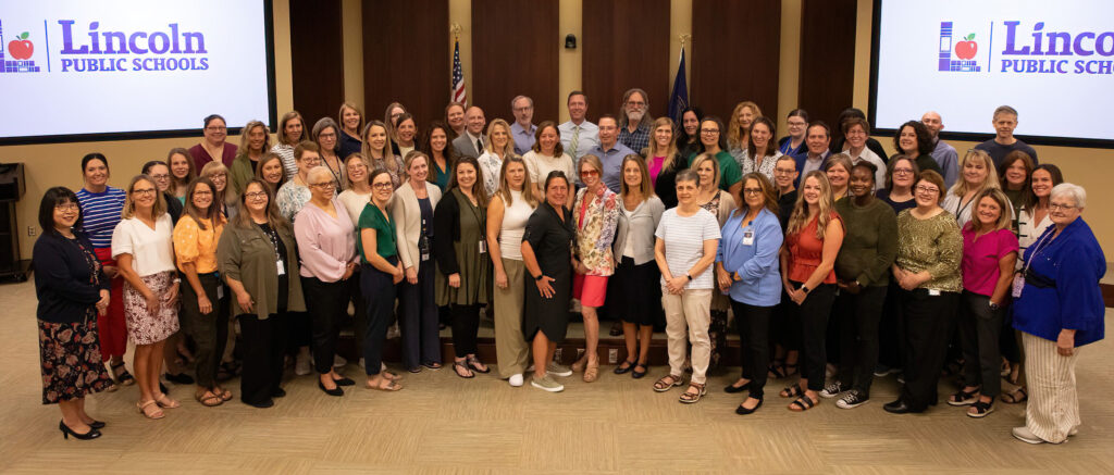 Curriculum and Instruction staff posing in the LPS Board Room
