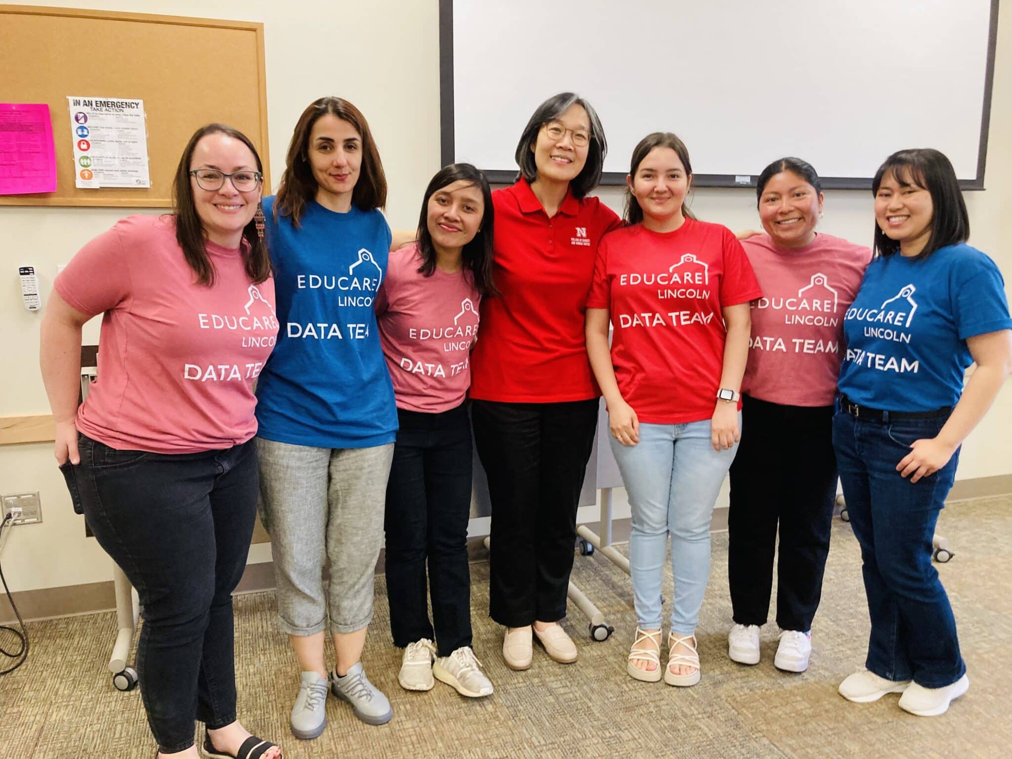 A group photo of 7 individuals wearing shirts that say "Educare Data Team"