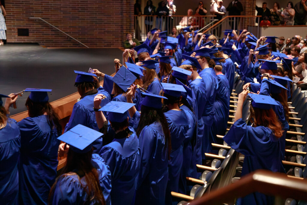 Bryan students in graduation gowns celebrating