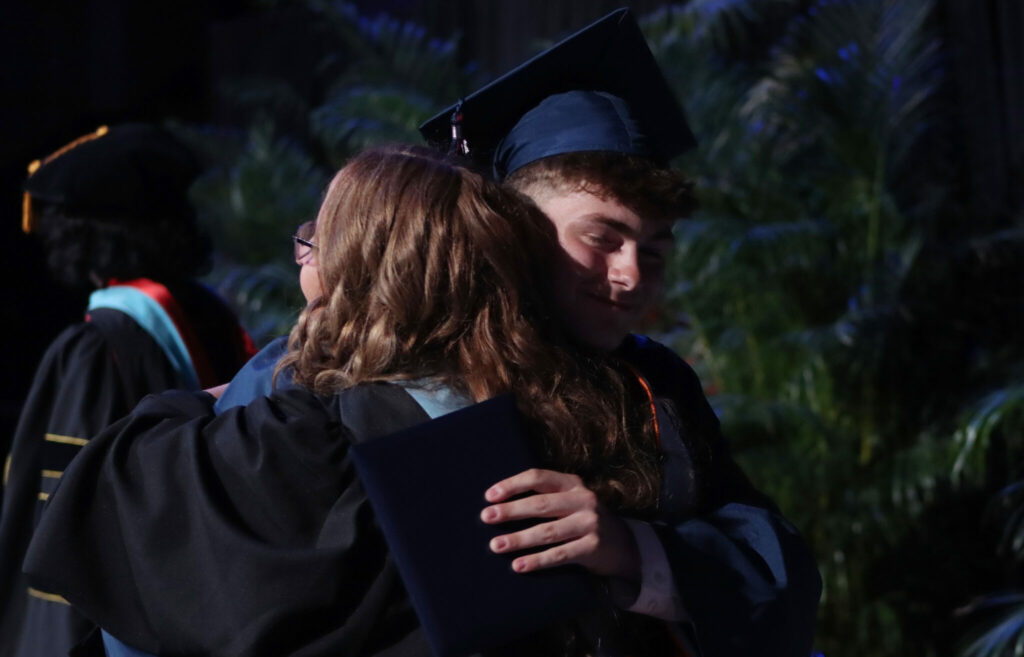 North Star student hugging their principal at graduation