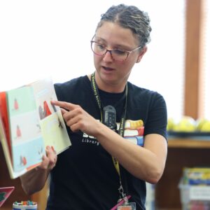 Mrs. Neff points to a picture book while reading it aloud