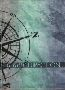 Yearbook cover titled A new Direction showing a compass