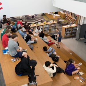 A wide shot of several students working on the learning stairs.