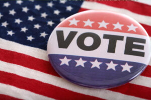 A vote button with an American flag