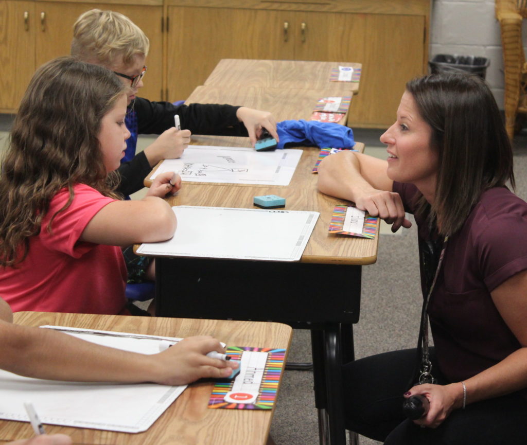 Second Grade Teacher, Patti Hall, discusses the lesson with her students