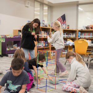 Students participate in makerspace activities in the library.
