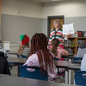 Students listen to a read aloud in the library.