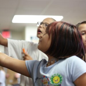 Two students find the book they are looking for.