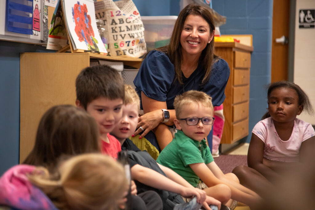 A teacher and her elementary school students learn about one another on the first day of school.